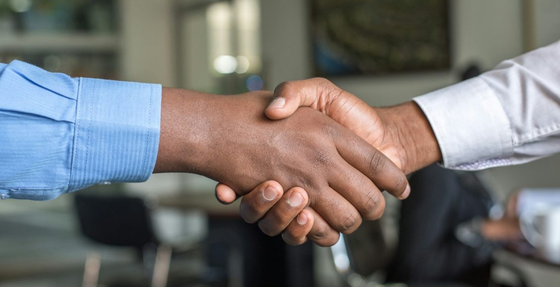 two people shaking hands