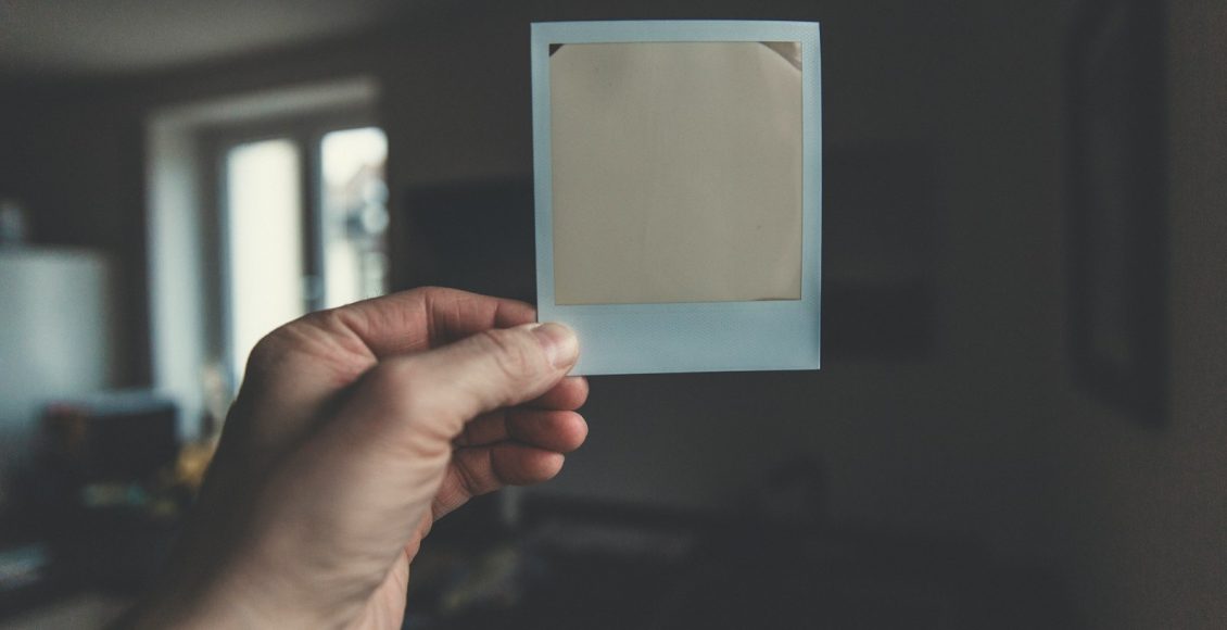 person holding white paper