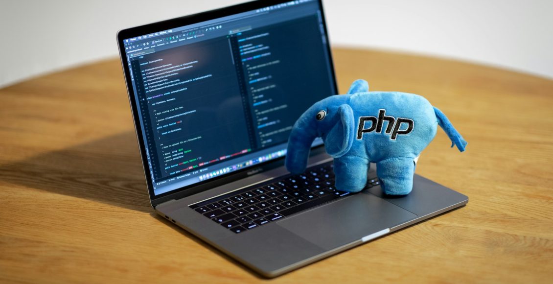 blue elephant figurine on macbook pro